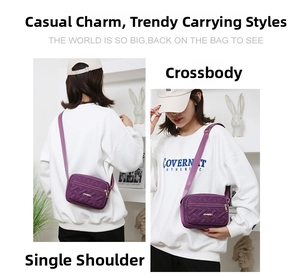Detail view of purple oxford crossbody bag showing adjustable strap and golden zipper closure