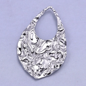 Macro view of 304 stainless steel teardrop pendant with textured lava finish surface