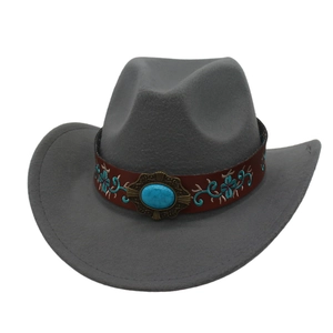 Close-up of gray felt cowboy hat featuring a brown leather band with turquoise stone