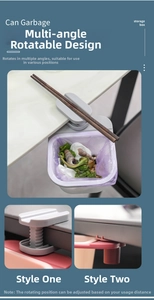 Close-up of rotatable clip base for desk-side mini trash bin in gray and red finish