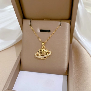 Elegant gold titanium planet necklace with sparkling crystals in a luxury jewelry box