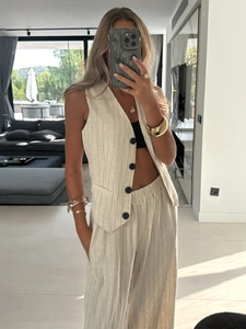 Chic beige pinstripe two-piece set featuring a tailored vest and high-waist wide-leg pants