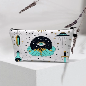 Detail of waterproof makeup bag featuring mystical crystal ball and magic theme prints