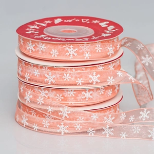Detail of 1cm sheer pink snowflake organza ribbons for Christmas gift wrapping