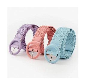 Close-up of woven PU leather belts in purple, pink and blue with round buckles