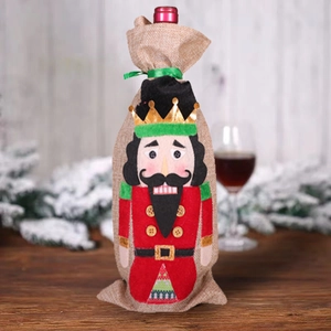 Nutcracker soldier wine bottle cover for Christmas table decor with red linen design