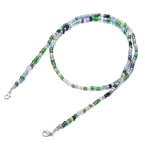 Detailed macro shot of colorful glass beaded eyewear chain with silver lobster clasps