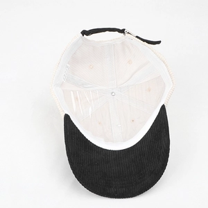 Detail view of corduroy baseball cap interior showing sewing quality and cotton wash label