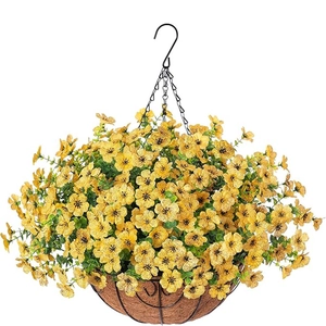 Close-up of yellow artificial flowers in a metal hanging basket with coconut fiber liner