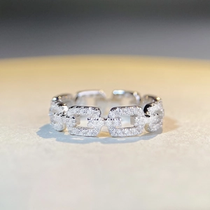 Sparkling S925 sterling silver chain ring with clear pavé crystals on a textured surface