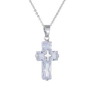 Detailed close-up of a silver cross pendant inlaid with sparkling AAA cubic zirconia
