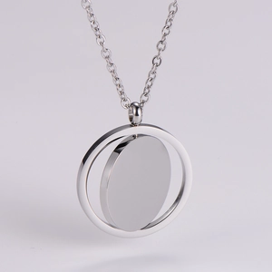 Detail of silver rotating double ring pendant with smooth 304 stainless steel finish