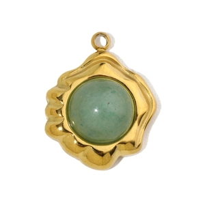 Detail of a green stone pendant with a wavy gold stainless steel frame for necklaces