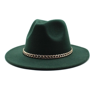 Detail of dark green wool fedora hat featuring a decorative glossy gold chain band