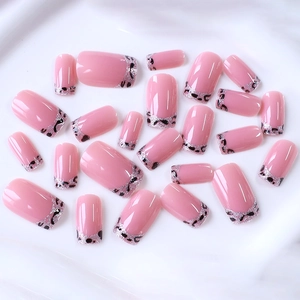 Pink French leopard print press-on nails with silver glitter and black spots