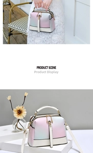 Detail of gradient macaron Boston bag with gold hardware and removable shoulder strap