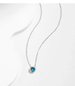 Exquisite S925 silver necklace with a round Paraiba-colored gemstone pendant on white background