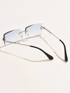Detail view of rimless square sunglasses featuring blue gradient lenses and silver metal temples