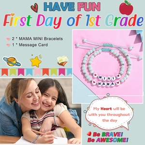 Detail view of MAMA and MINI braided bracelets with a First Day of School card