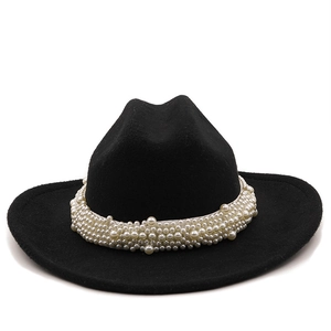 Detail view of a black wool jazz fedora hat featuring elegant multi-layer pearl decorations