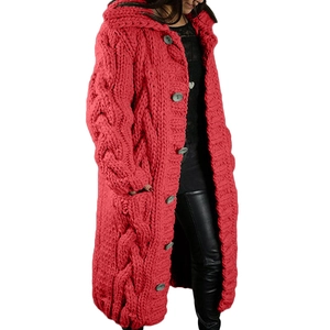 Detailed close-up of red cable knit hooded cardigan with five grey buttons and side pockets