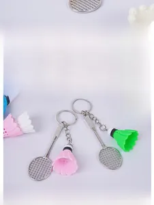 Detailed view of mini badminton racket keychains in silver finish with colorful shuttlecocks