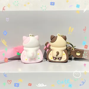 Cute cartoon cat cake roll keychains in pink and brown with silicone wrist straps