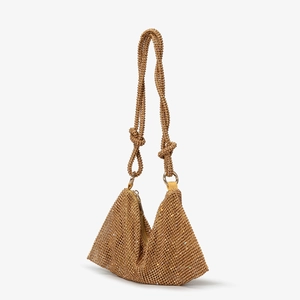 Detailed view of the luxury gold rhinestone hobo bag with sparkling knotted shoulder strap