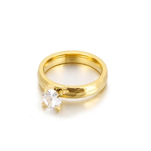 Minimalist hammered gold ring featuring a four-prong set round zircon solitaire stone