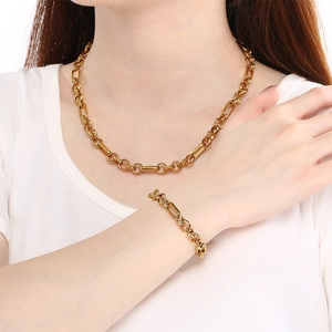 18K gold plated titanium steel necklace featuring long oval links and pearls on a model