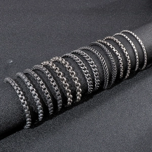Close-up of diverse vintage stainless steel chains including Cuban and keel styles