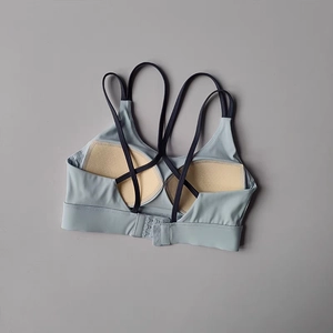 High-impact cross-back sports bra with fixed pads and adjustable hooks in light grey blue
