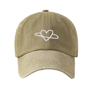 Vintage washed khaki baseball cap with white heart embroidery on a white background