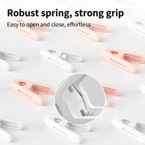Windproof plastic laundry clips in pink and white with heavy duty springs