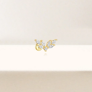 Detail of S925 sterling silver gold ear stud with marquise-cut white zircon leaf design