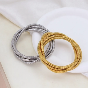 Detail of multi-layer stainless steel snake chain bracelets with cylindrical clasp