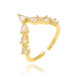 Vintage gold V-shaped open ring with pear-cut zircon stones on a white background