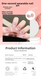 Detail view of pink gradient press-on nails with cartoon patterns and 24pc size chart