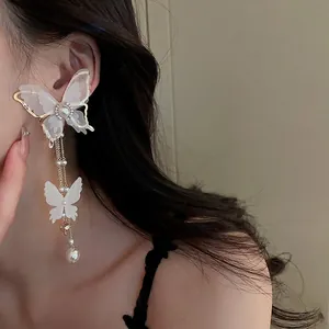 Elegant butterfly tassel earrings with pearls and crystal fringe for a fairy-inspired look