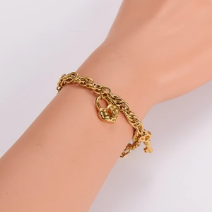 Bracelet à maillons en acier inoxydable doré avec pendentifs cadenas cœur et clé