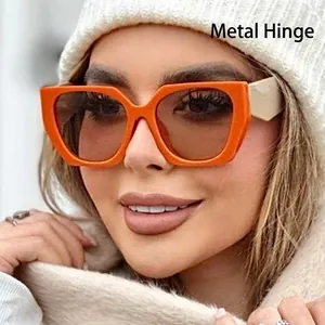 Fashionable oversized orange polygon sunglasses for women featuring durable metal hinges
