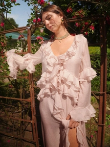 Elegant light pink chiffon maxi dress with deep V-neck and layered ruffle details
