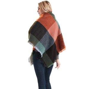 Rear view of extra large herringbone triangle shawl with colorful blocks and fringe trim