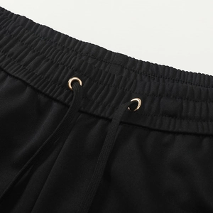 Men's straight leg sports pants in black with elastic drawstring waist detail