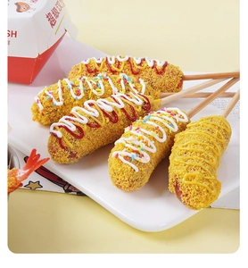 Detailed view of five breaded cheese corn dogs with colorful sauces on a white platter