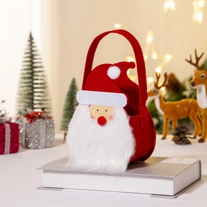 Cartoon Santa Claus felt gift bag for Christmas decorations on a cozy festive setting