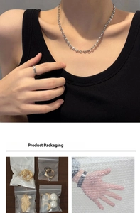Detail of silver chain necklace and ring with protective PE bag packaging and bubble wrap