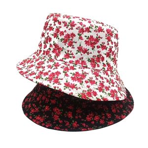 Double-sided floral bucket hat in black and white with red flower pattern prints