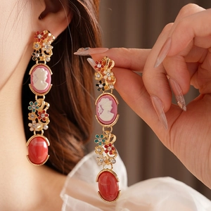 Vintage cameo earrings with pink female portrait and red oval drop gemstone