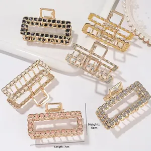 Detailed view of 7cm rectangular metal hair claws with elegant hollow chain texture